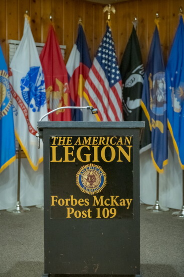 Nearly eight decades of service and sacrifice stand behind the podium at American Legion Post 109.