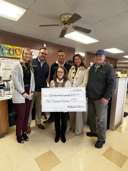 Presenting a check to St. Andrews Food Cupboard