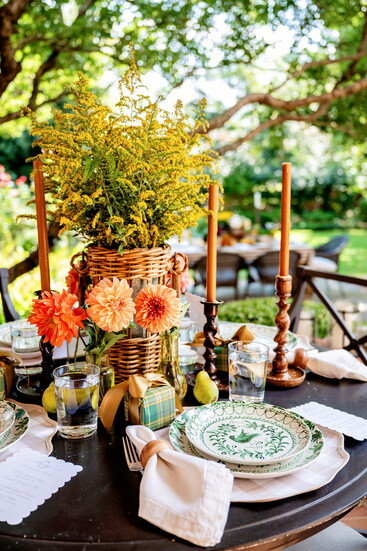 Pitts is a fan of creatively using what you have around the house. She wrapped small boxes as presents to layer the table design, noting that they can be empty 