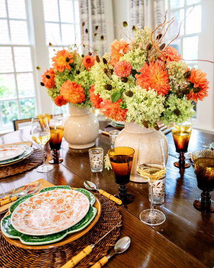 Trader Joe’s is a great resource for inexpensive but beautiful-looking flowers, says Pitts. Here she mixes brown glass water goblets with traditional stemware 