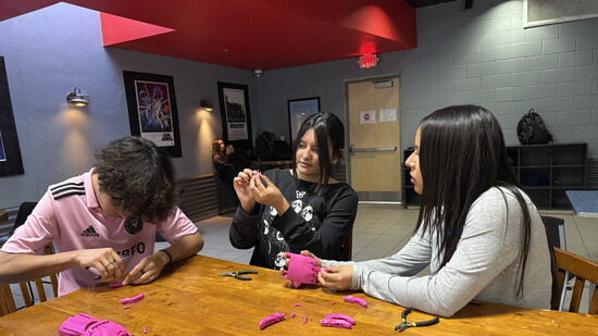 WISE Scholars building the prosthetic arm