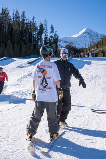 Cody Ling coaches an athlete; photo by Josh Lucas