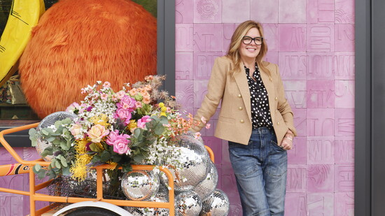 Founder Conni Reed poses outside the Katy store.