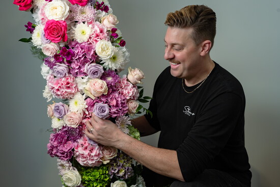 Custom floral arch by Paul Porche-Riner of Stems On The Move, created with more than 600 fresh stems.