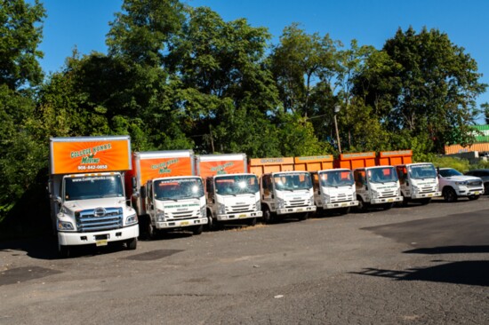 The fleet of College H.U.N.K.S. trucks! 