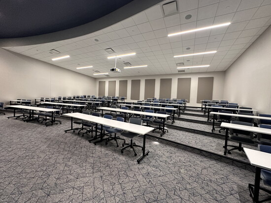 A theater-style-tiered classroom accommodates 98 guests.