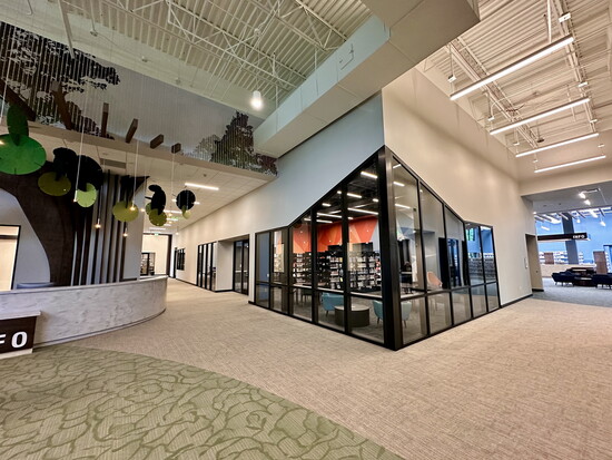 The hallway overlooks a large, dedicated area that gives teens their own space.