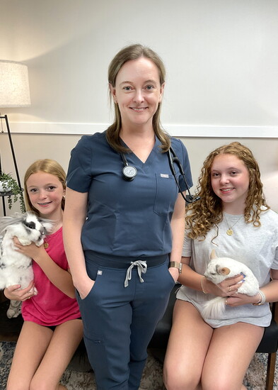Dr. DiPaulo with her daughters Carla (holding Garnet the Rabbit) and Bella (holding Olaf the Chinchilla)