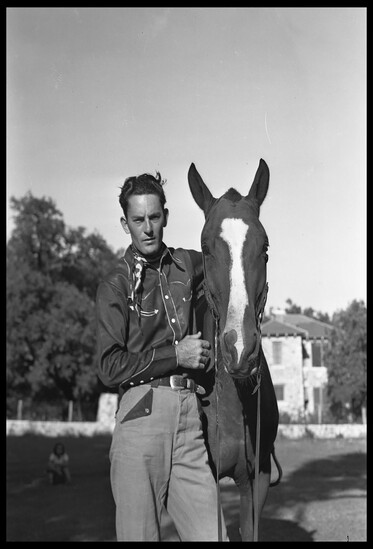 A Texas cowboy with his horse.