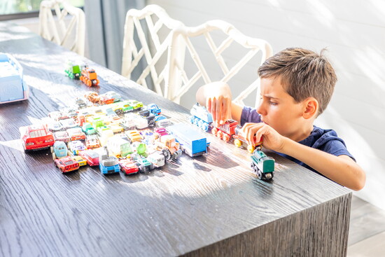 Stephanie's son, William playing with his favorite trains