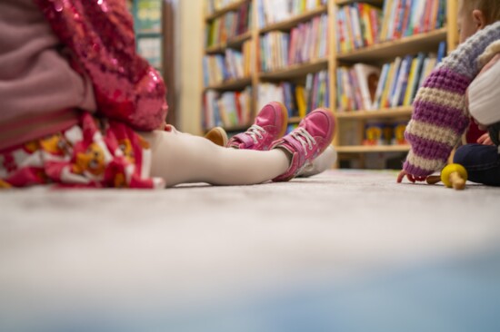 Even the smallest feet are still during Tulsa Toy Depot's story time.