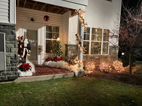 A Christmas front porch designed by Mother Nature's Landscaping. 