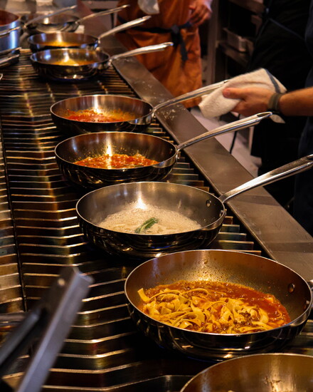 Pastas being prepared in the open kitchen