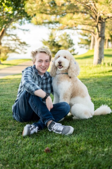 Alex Hess with Goldendoodle Sadie, his diabetic alert service dog. Andrea Flanagan Photography.