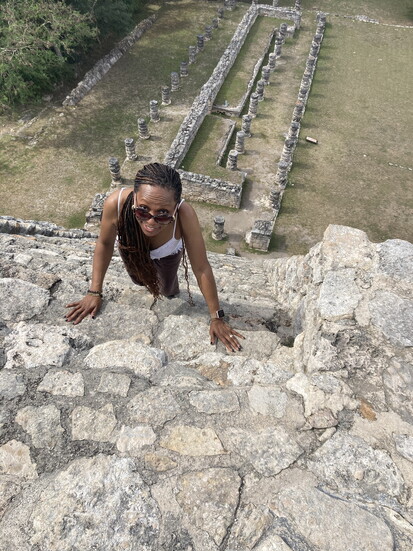 Climbing the pyramid at Mayapán.