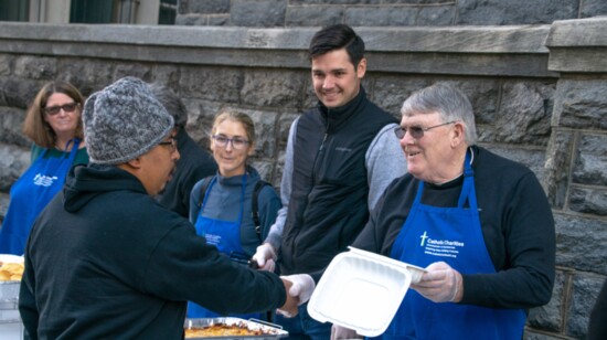 Father John at a St. Maria’s Meals service at the Catholic Charities headquarters. 