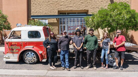1957 firetruck tow truck with the staff of Mufflers and More.