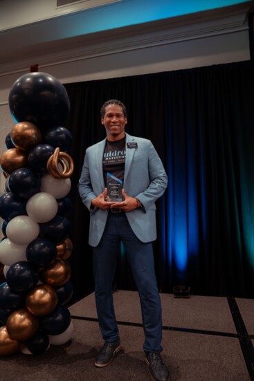 Jason Muldrow displays his trophy after winning the Fayette County Chamber of Commerce Small Business of the Year. 