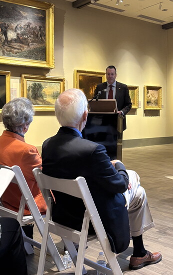 The Brown's new board chair, Andy Watts, announcing The Brown's construction and rebranding on December 2, 2026 as Cici and Hyatt Brown look on