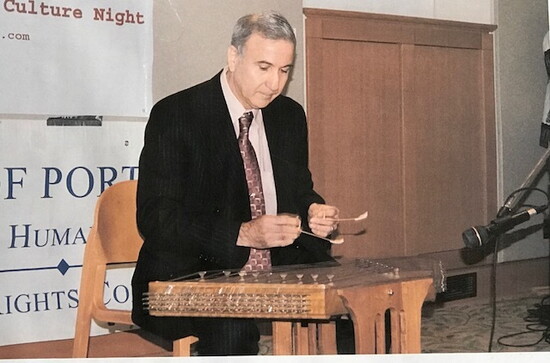 Salehi performing and playing the Santoor 