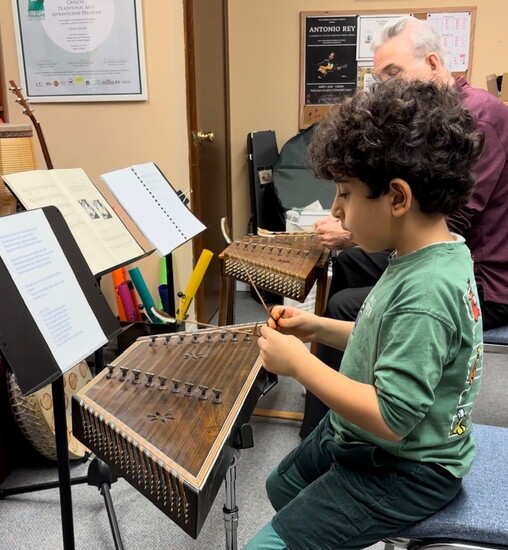 Salehi teaching a student the Santoor 