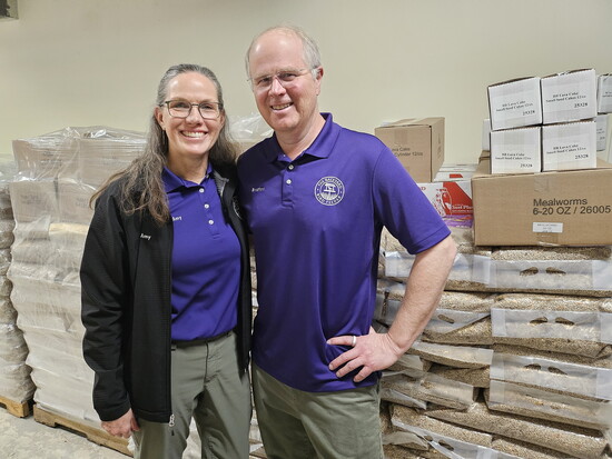 Owners Bradford and Amy, with 10,000 lbs. of birdseed. Image courtesy of David Lambert
