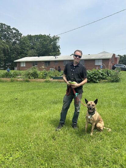 Robert Harrison and Dio, the dynamic duo of green thumbs and wagging tails.