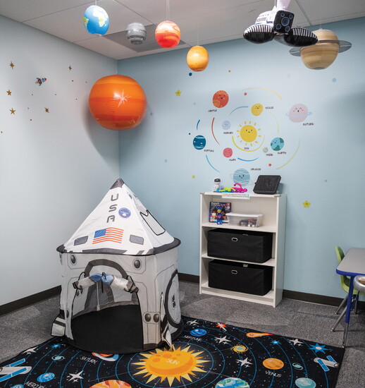 Themed rooms like the space room inspire imagination and creativity.