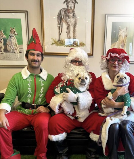 Santa, Mrs. Claus and an elf helper visit the pets every Christmas at New Inn Kennels. 