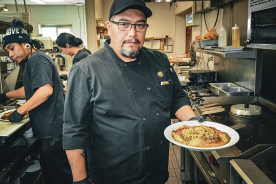 Chef Joshua Aragon plates up an India Taco