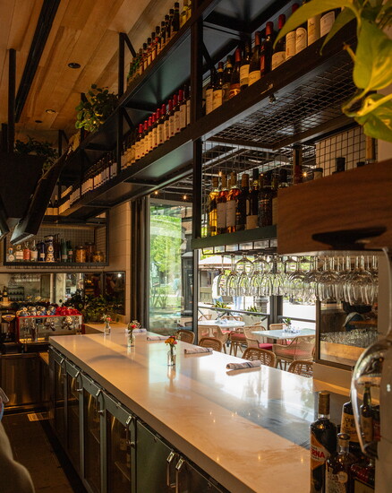 Live plants in the main dining room create a sense of home.