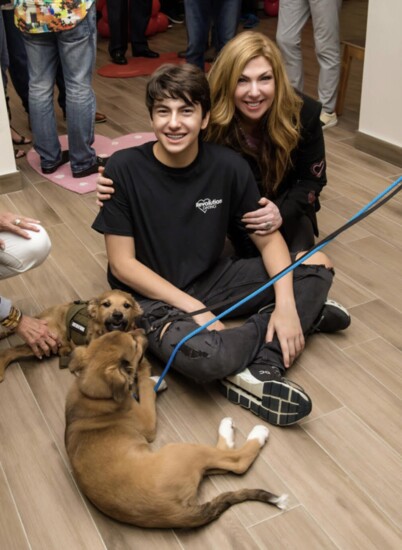 Must Love Dogs! Kelly and son host a charity fundraiser for Furry Friends Animal and Adoption Clinic. 