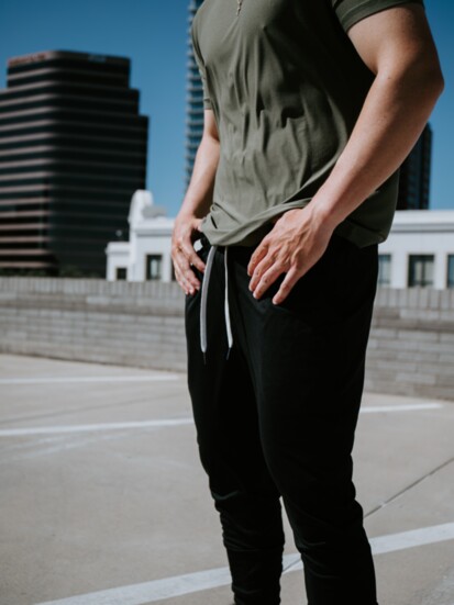 On Jackson: Military Green Active Crew Neck, Black Active Joggers.