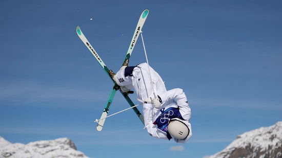 Charlie Mickel in the midst of perfectly executing a D-Spin Iron Cross