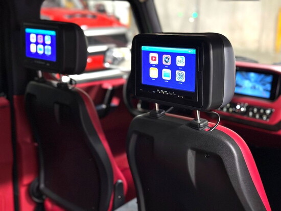Luxury interior of the Mini E-Wagon in red and black.
