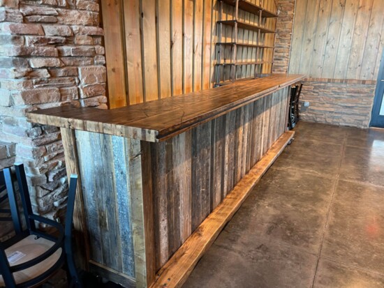 Ben Dragoo designed and built this vintage-looking bar from reclaimed wood.