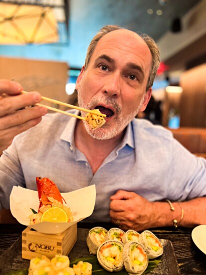 Lifestyle editor Sean O'Keefe enjoying Lobster Tempura and Baked Snow Crab Cut Rolls