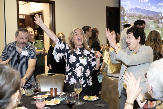 Linda, celebrating with a raffle winner