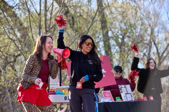 Kim Russick from lululemon and miles.Beyond Race Director Mandy Mullen bring the energy, cheering on runners as they crush their goals!