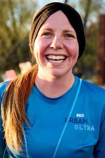 Alexis Templenuevo smiles at the NOCO Urban Ultra, a race that beautifully captures encouragement and resilience.