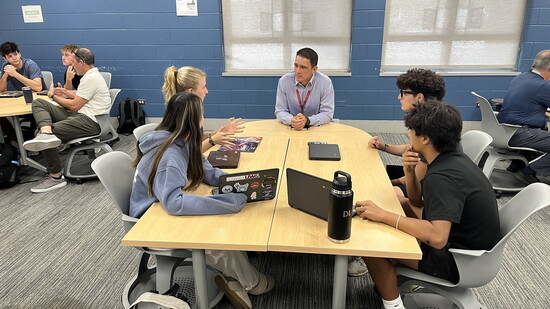 Business INCubator students at Glenbrook South collaborate during a candid class work session.