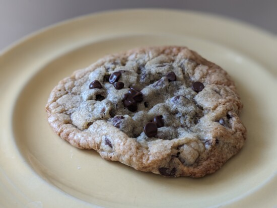 Delicious Chocolate Chip Cookie with crunchy, crisp edges and soft, gooey middle.