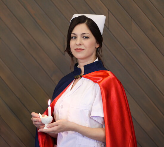Aubrey Mann holds a Nightingale lamp | Photo: D.P. Soule Photography