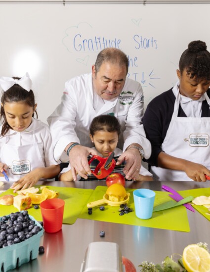 Emeril mentors the youth in the kitchen