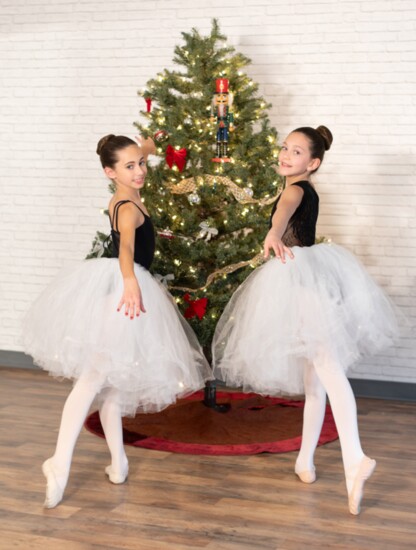 Cousins Stella Tompkins and Olivia Geluso, both set to dance the lead of Marie/Clara this year. Photo by Laura Ross