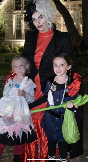 Cruella and her little zombie and police officer.