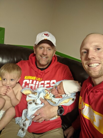 Coach with his son Tyler and kids