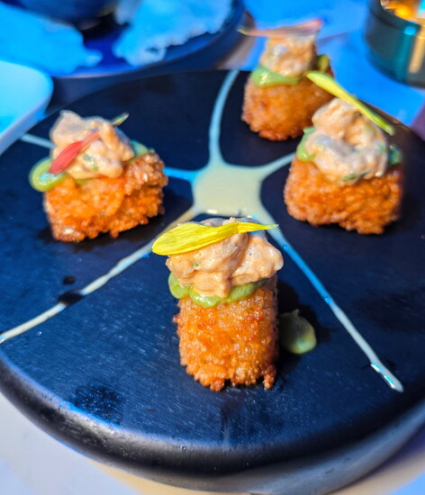 "The Eye's menu features a tempting selection of shareable plates, crafted with care and full of bold flavors."