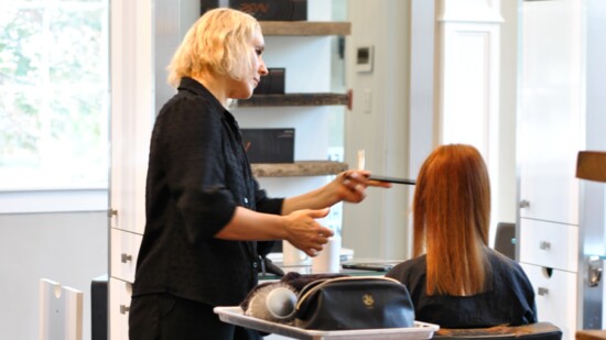 Oksana Villeneuve works with a client