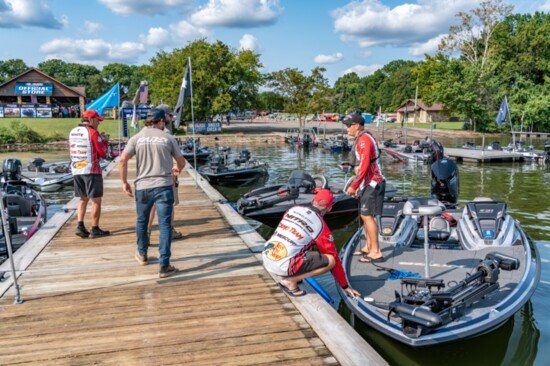 Fishermen check their rigs  before their weigh-in times.